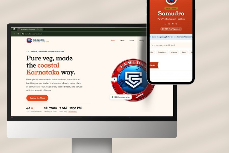Samudra Veg Restaurant's site on a desktop monitor: the hero reads 'Pure veg, made the coastal Karnataka way' with an Explore the Menu button and a row carrying the rating, the years open and the daily hours, beside the restaurant's crest and a phone showing the QR menu.